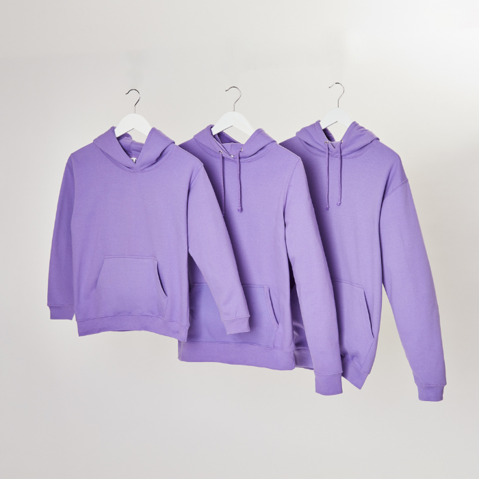 3 hoodies ranging from kids to adults in digital lavender floating on hangers
