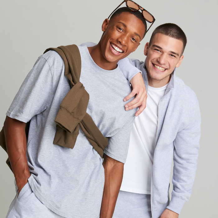 Two male models wearing grey clothing